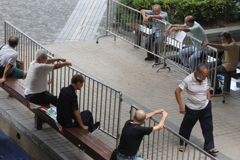 Elderly men sit behind barricades with a “no entry” sigh in Tsim Sha Tsui, on September 4, 2020. The WHO is calling for a convention on the rights of older persons. Photo: K.Y. Cheng