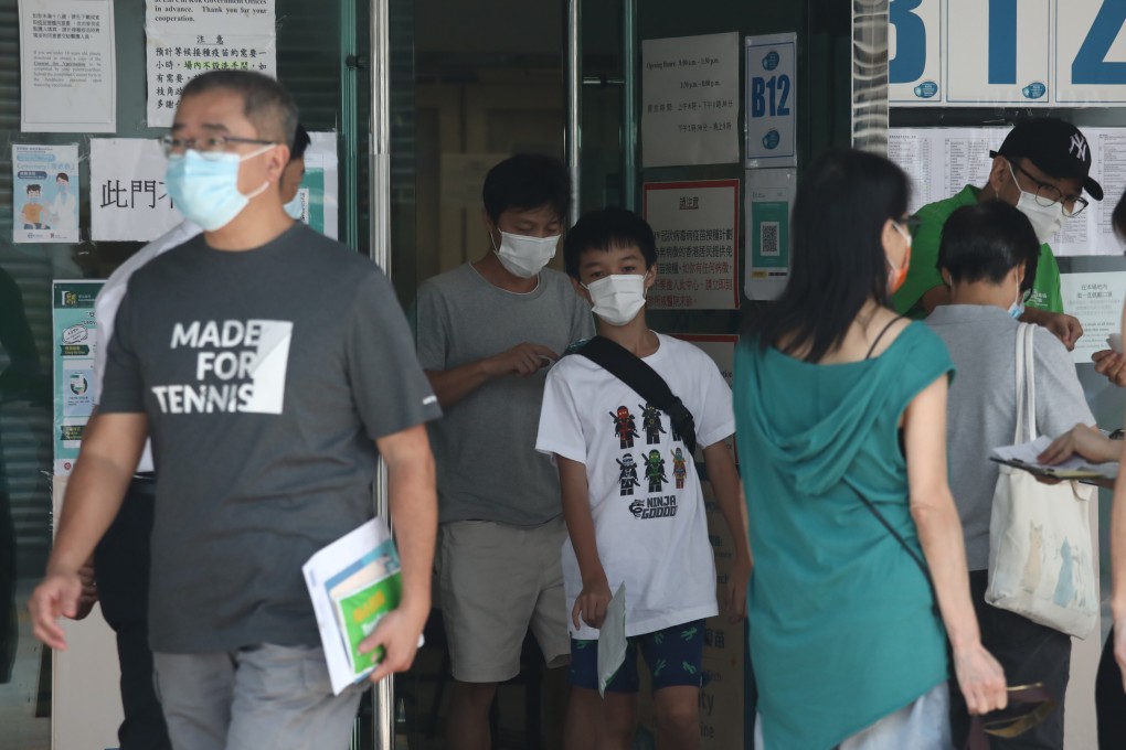 People leave after being given the BioNTech vaccine at Lai Chi Kok Park Sports Centre. Photo: Jonathan Wong