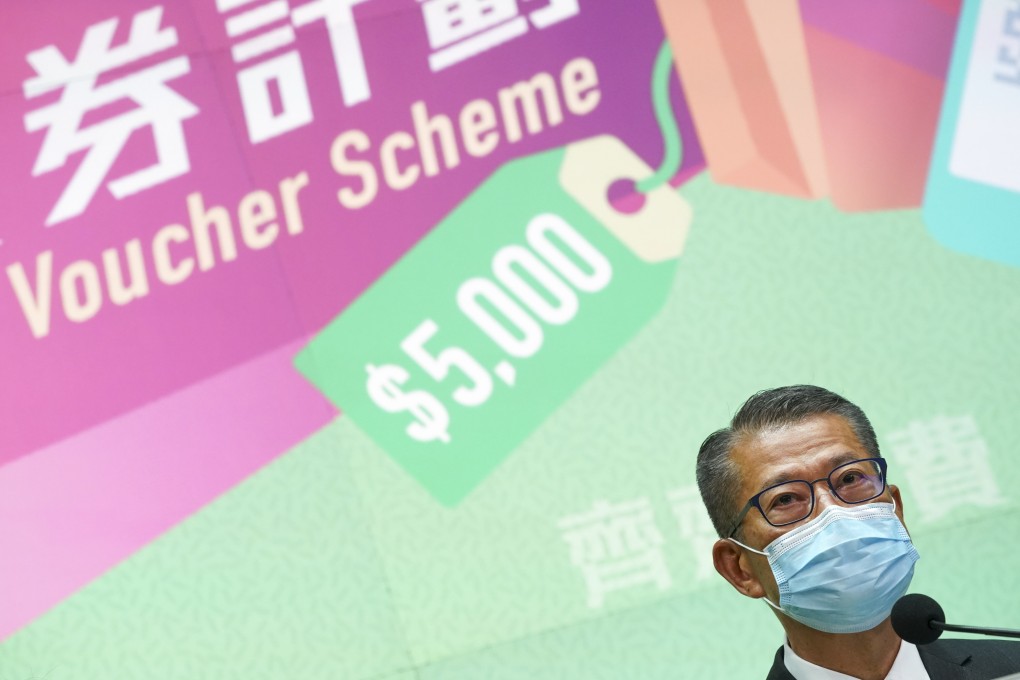 Financial Secretary Paul Chan announces details of the consumption voucher scheme on Friday. Photo: Felix Wong