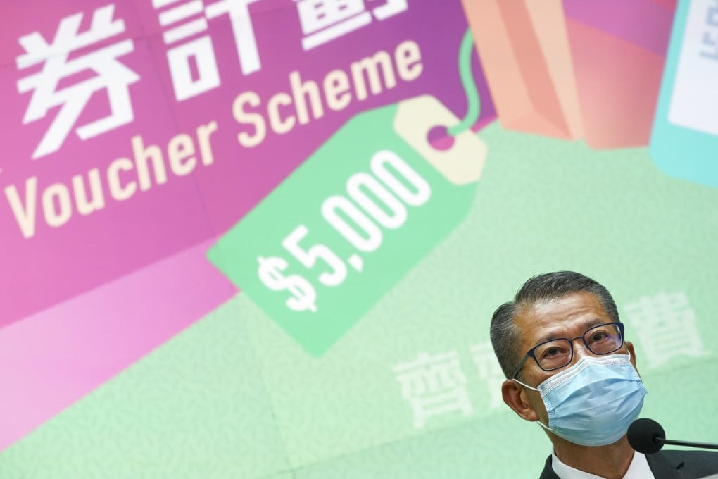 Financial Secretary Paul Chan announces details of the consumption voucher scheme on Friday. Photo: Felix Wong