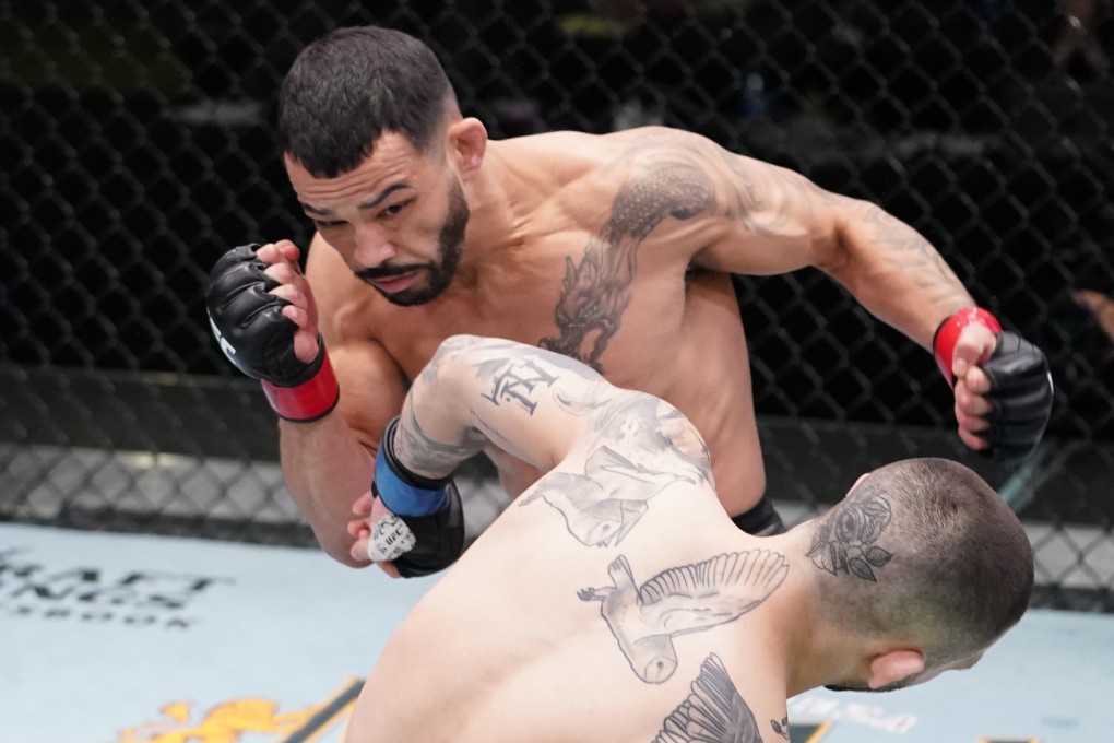 Dan Ige knocks out Gavin Tucker in a featherweight bout at UFC Vegas 21. Photo: Jeff Bottari/Zuffa LLC via Getty Images