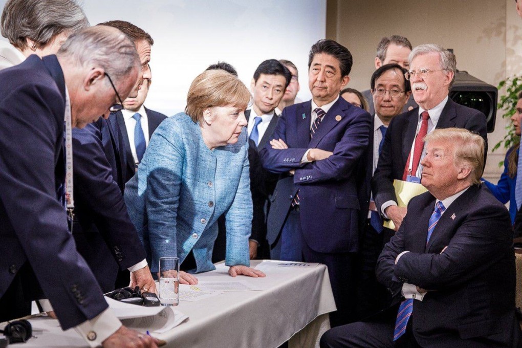 Angela Merkel talks to then US president Donald Trump, surrounded by other G7 leaders, during a summit in La Malbaie, Quebec, Canada, on June 9, 2018. The photo went viral on social media, spawning a plethora of memes. Photo: AFP/Bundesregierung