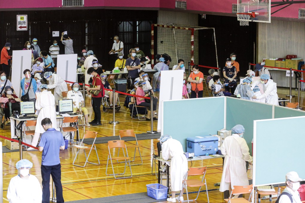 People wait to be inoculated at a vaccination centre in Taipei on June 15.  Photo: Bloomberg
