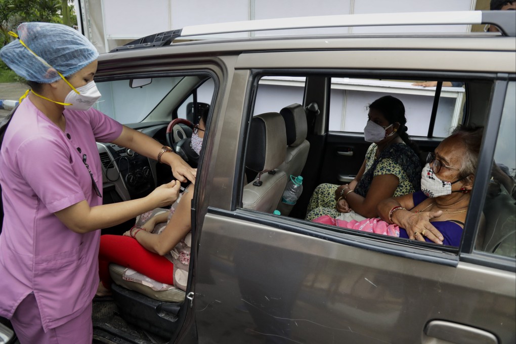 A health worker administers Covishield, Serum Institute of India’s version of the AstraZeneca vaccine in Kolkata, India on Wednesday. Photo: AP