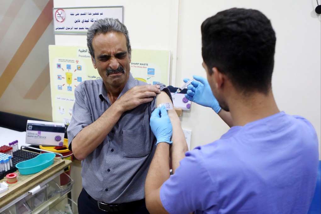 A Palestinian medical worker receives a Covid-19 vaccine at the Palestinian Red Crescent Hospital in the West Bank city of Hebron on Friday. Photo: EPA-EFE