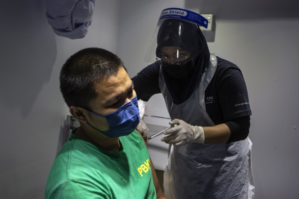 A man receives a Covid-19 vaccine shot in Kuala Lumpur, on June 20, 2021. Photo: EPA-EFE