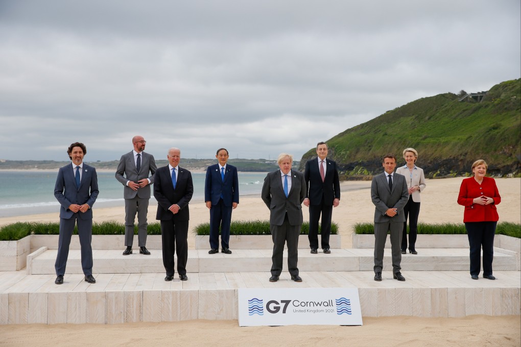 (From left) Canadian Prime Minister Justin Trudeau, president of the European Council Charles Michel, US President Joe Biden, Japanese Prime Minister Yoshihide Suga, British Prime Minister Boris Johnson, Italian Prime Minister Mario Draghi, French President Emmanuel Macron, president of the European Commission Ursula von der Leyen and German chancellor Angela Merkel on the first day of the G7 summit in Cornwall, Britain, on June 11. Photo: EPA-EFE