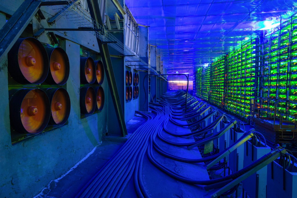 Industrial cooling fans operate to thermally regulate illuminated mining rigs at the CryptoUniverse cryptocurrency mining farm in Nadvoitsy, Russia, on March 18. The rise of bitcoin and other cryptocurrencies has prompted the greatest push yet among central banks to develop their own digital currencies. Photo: Bloomberg