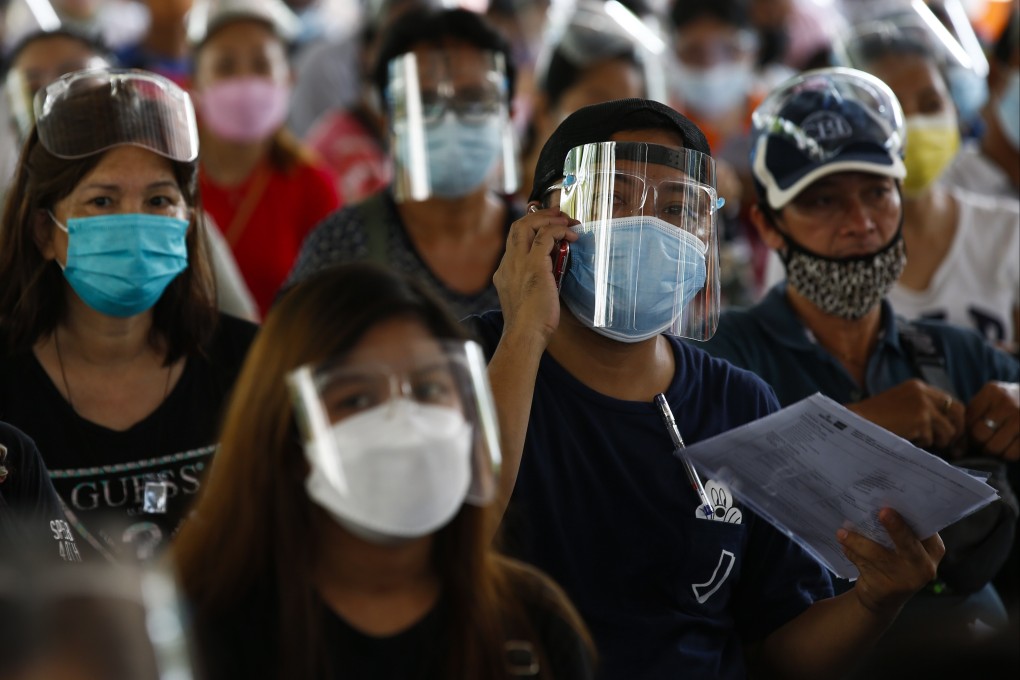 People wait to get inoculated with the Pfizer vaccine in Caloocan City, Metro Manila. Photo: EPA-EFE