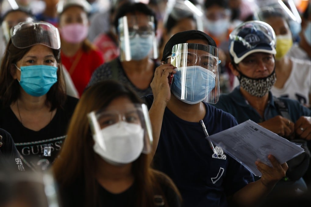 People wait to get inoculated with the Pfizer vaccine in Caloocan City, Metro Manila. Photo: EPA-EFE