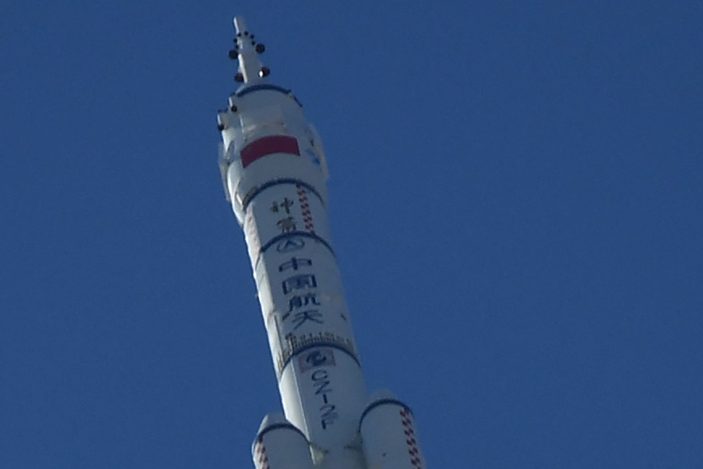 A Long March-2F carrier rocket, carrying the Shenzhou-12 spacecraft and a crew of three astronauts, lifts off from the Jiuquan Satellite Launch Centre in the Gobi Desert in northwest China on June 17, 2021. Photo: AFP