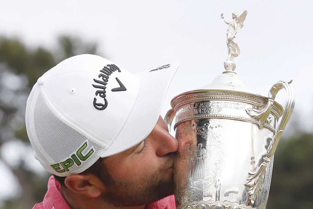 Jon Rahm celebrates his first major win with the US Open Championship Trophy after winning at Torrey Pines. Photo: EPA