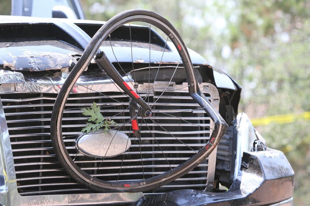 A bicycle wheel on the front of a pick-up truck that  ran over a group of cyclists in Show Low, Arizona, US on Saturday. Photo: The White Mountain Independent via AP
