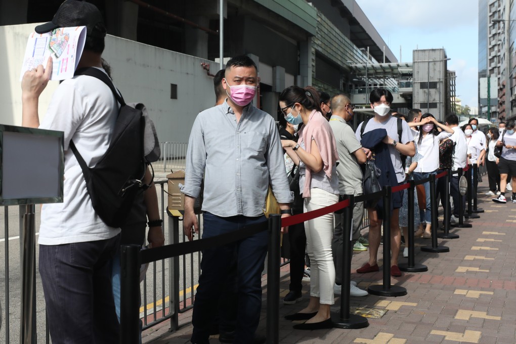 Potential buyers queue up to buy flats at the South Land project in Wong Chuk Hang, on May 15. Photo: Xiaomei Chen