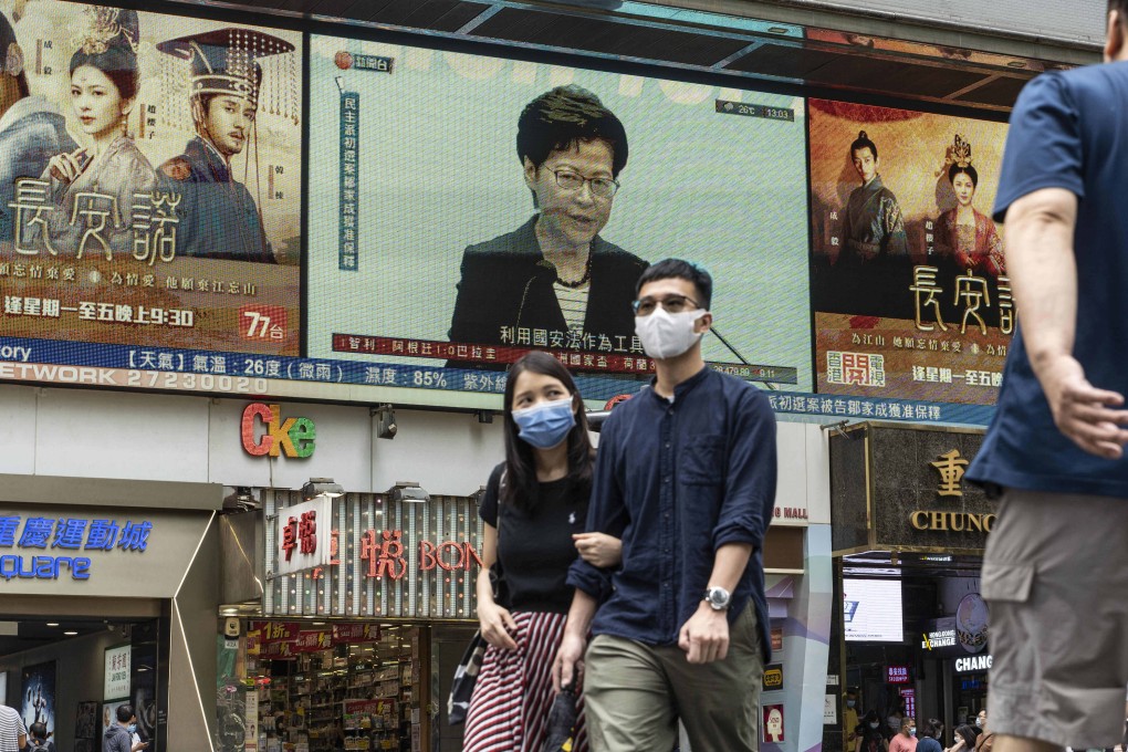 A public screen broadcasts a press conference by Hong Kong Chief Executive Carrie Lam, in the city’s commercial and shopping district of Tsim Sha Tsui on June 22. Photo: SOPA Images via ZUMA Wire/dpa