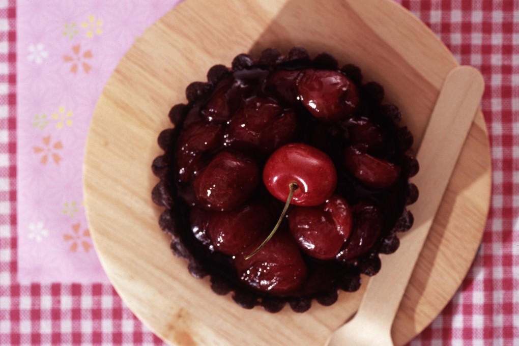 This double-chocolate cherry tart is rich and decadent, and best served warm from the oven. Photo: Koji Studio
