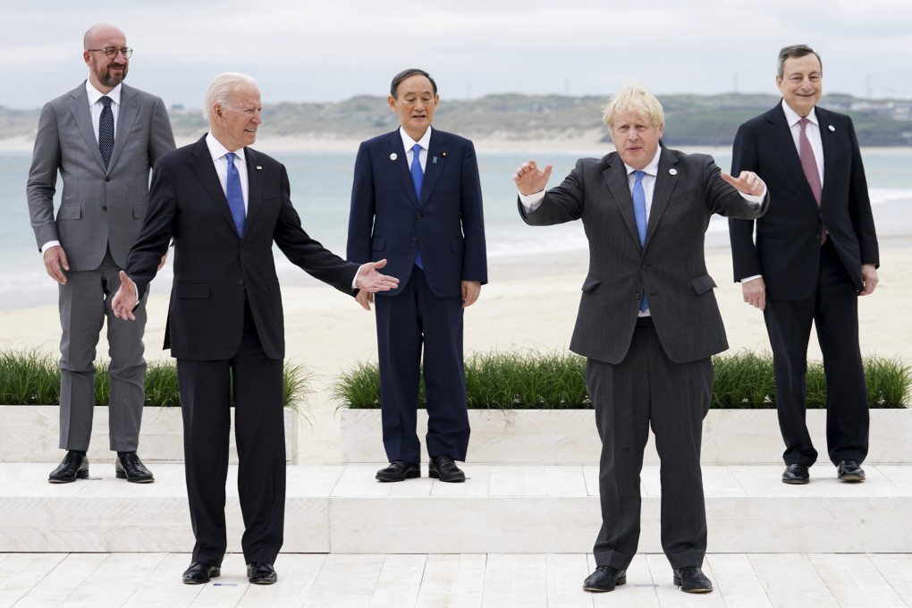 Leaders (from left) European Council President Charles Michel, US President Joe Biden, Japanese Prime Minister Yoshihide Suga, British Prime Minister Boris Johnson and Italian Prime Minister Mario Draghi enjoy a group photo at the G7 meeting in Carbis Bay, England, on June 11. Photo: AP