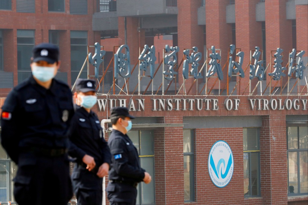 Security personnel keep watch outside the Wuhan Institute of Virology in Wuhan, Hubei province, during the visit by a WHO team tasked with investigating the origins of Covid-19,  on February 3. Photo: Reuters