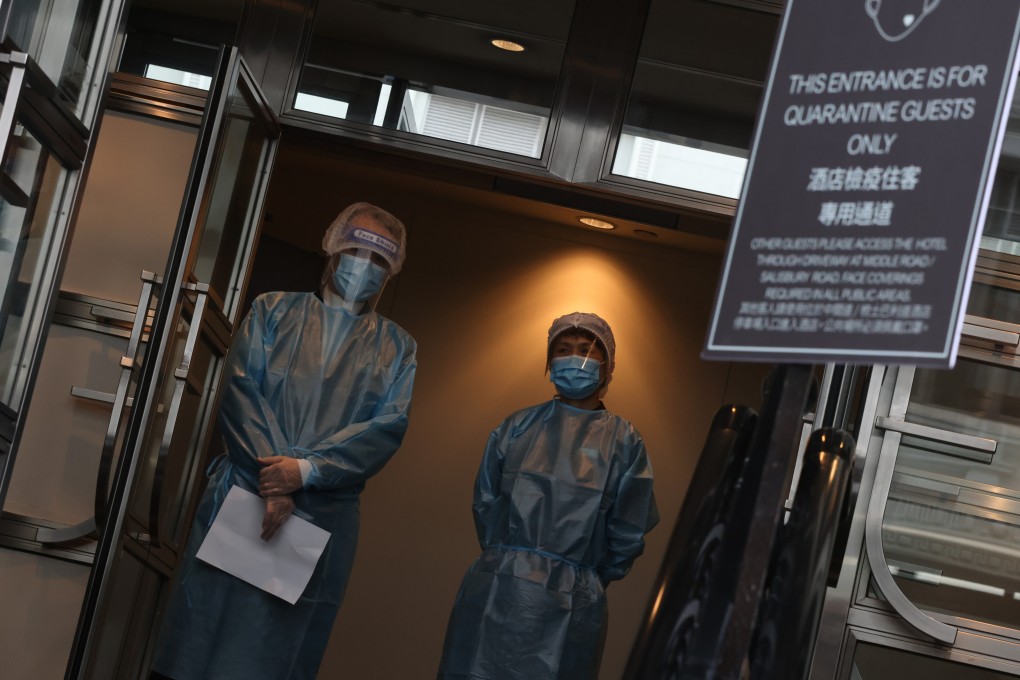 Staff members stand ready outside the Sheraton Hong Kong Hotel in Tsim Sha Tsui, one of the city’s designated quarantine hotels, on June 22. Photo: K.Y. Cheng