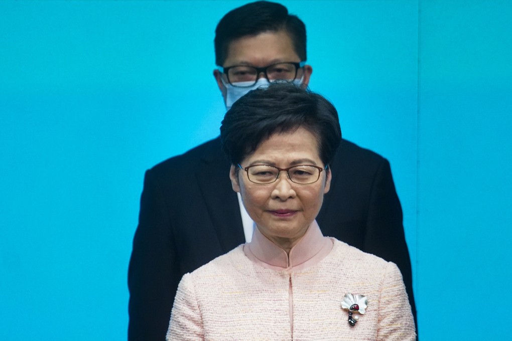 Newly appointed Secretary for Security Chris Tang walks behind Chief Executive Carrie Lam as they meet the media at the government headquarters in Admiralty on June 25. Both have expressed support for Hong Kong having a law to combat fake news. Photo: Winson Wong