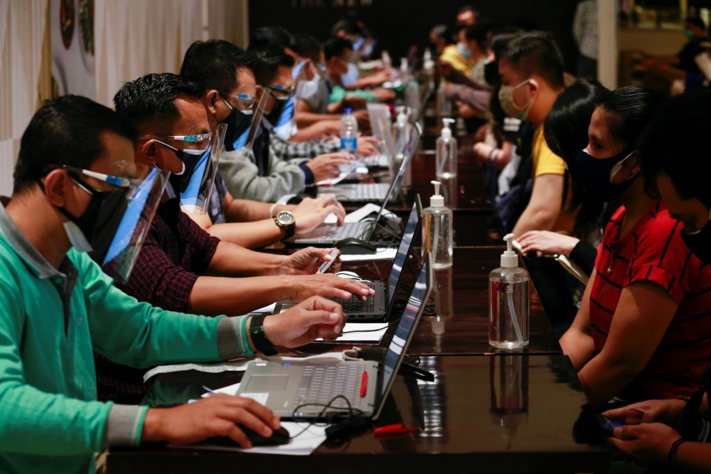People undergo health screening before receiving their dose of China’s Sinovac Covid-19 vaccine, during a mass vaccination programme at a shopping mall in Jakarta, Indonesia, on June 28. Photo: Reuters
