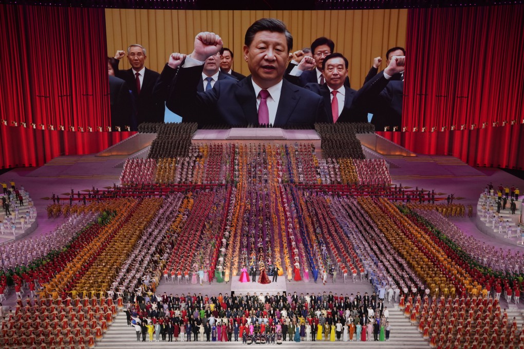 Chinese President Xi Jinping leads other top officials in pledging their vows to the party during a gala show in Beijing on June 28, ahead of the 100th anniversary of the founding of the Chinese Communist Party. Photo: AP