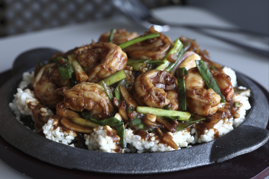 Sichuan-style shrimp with sizzling rice cakes. Photo: Jonathan Wong