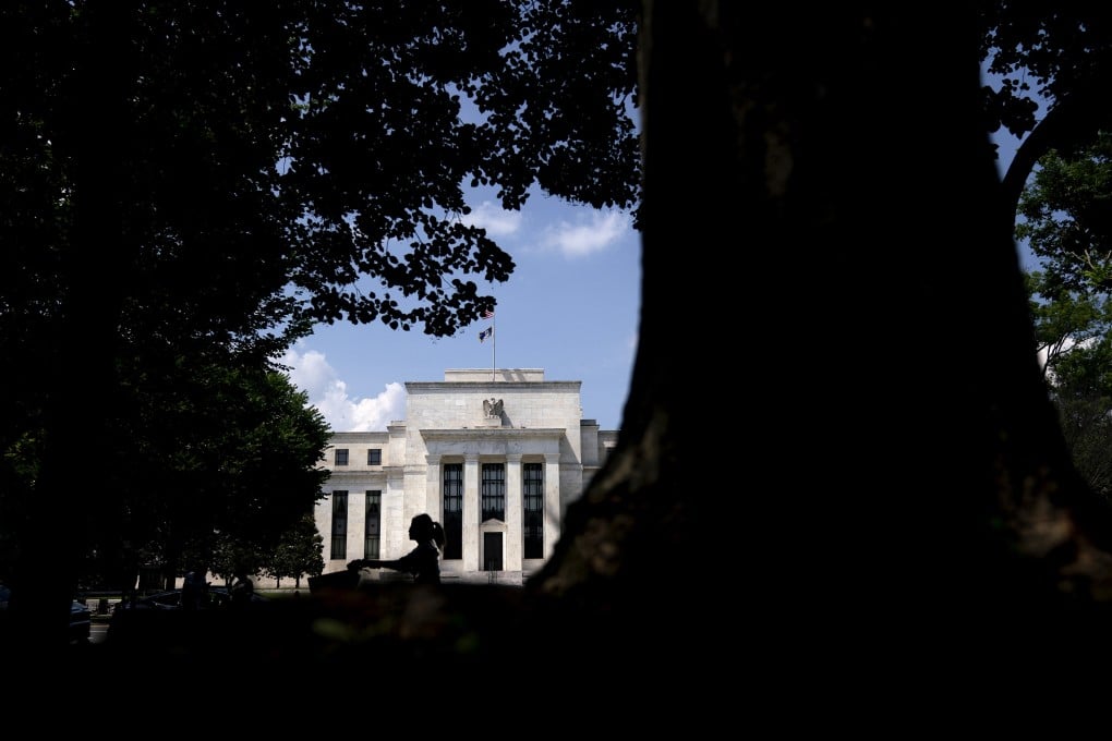A cyclist rides past the Federal Reserve building in Washington on June 20. Fed chair Jerome Powell told Congress last week that the Fed would wait for “actual evidence of actual inflation” before increasing rates – a monetary policy equivalent of leaving the door to a stable of expensive racehorses wide open. Photo: Bloomberg