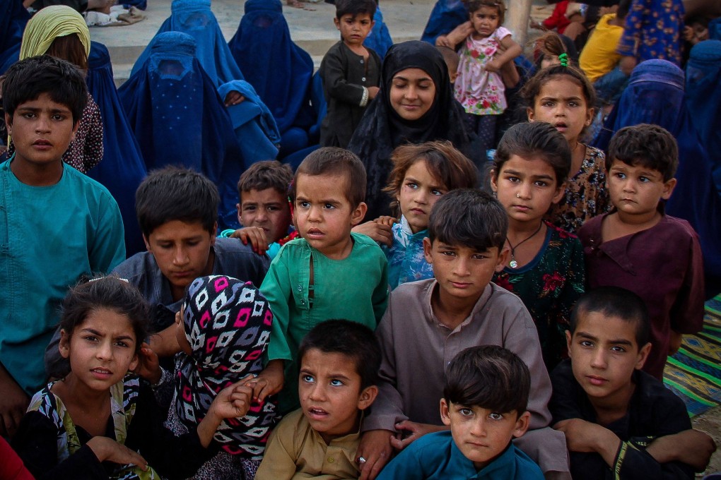 Children from Internally displaced Afghan families from Khan Abad, Ali Abad and Imam Sahib districts gather inside a school in Kunduz city on June 26, after fleeing from ongoing battles between Taliban and Afghan security forces. It is feared all-out civil war may follow the departure of the US military in Afghanistan. Photo: AFP