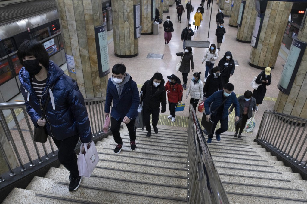 Commuters climb the stairs during the Monday morning rush hour at a subway station in Beijing.The lying-flat generation in China see no use for professional or social ladders. Photo: AP