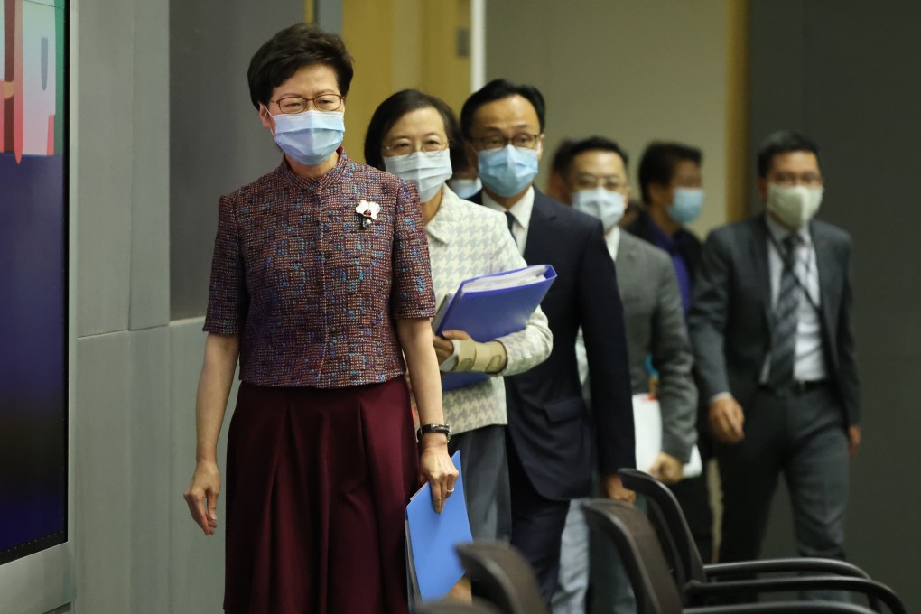 Chief Executive Carrie Lam, followed by Secretary for Food and Health Sophia Chan and Secretary for the Civil Service Patrick Nip Tak-kuen, walks into a press conference at the government headquarters in Admiralty on June 21. Photo: Nora Tam