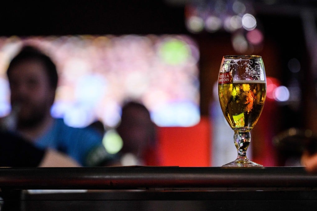 A glass of beer at a bar in Wan Chai. The nightlife district has seen a spate of “Devil’s Breath” attacks, in which drugged victims wake up with no memory of how their bank accounts were emptied. Photo: AFP