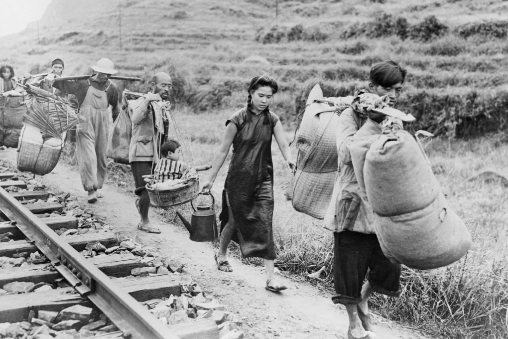 Chinese civilians burdened with household goods flee from the advancing Japanese troops in Eastern China in 1944. Photo: Getty Images