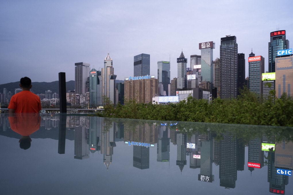 A man looks out at the Hong Kong skyline in May 2020. The city faces a massive increase in office supply in the coming years that threatens to snuff out any recovery in rents. Photo: Robert Ng
