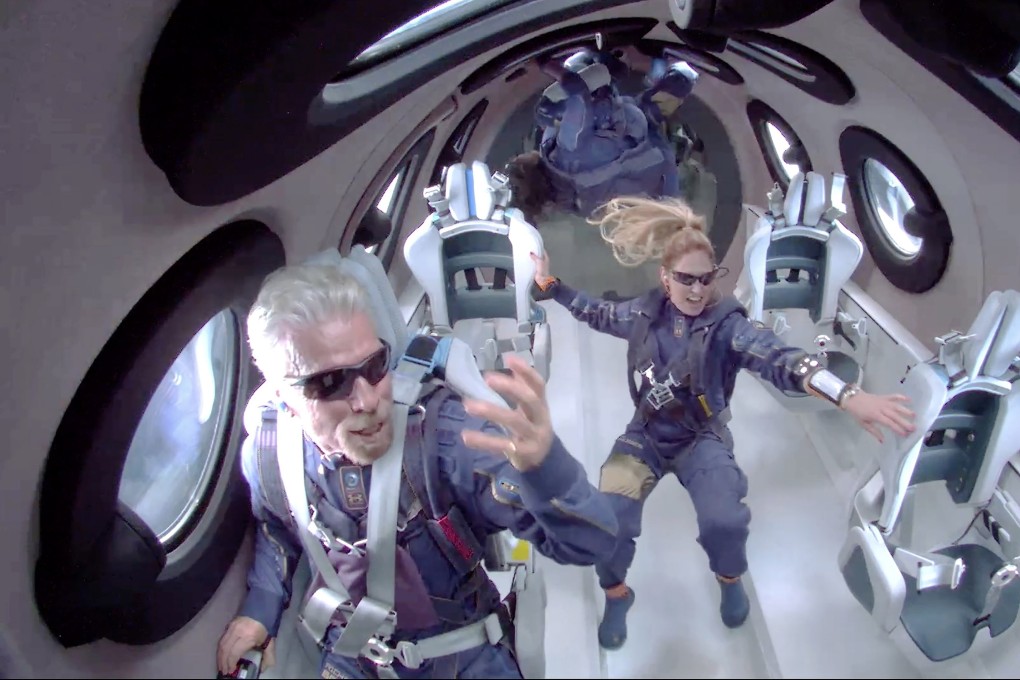 Sir Richard Branson (left) and other crew members attain zero gravity during their Virgin Galactic space flight. Photo: EPA-EFE