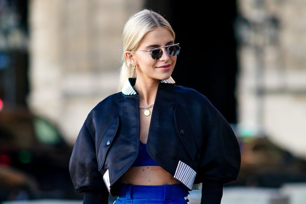 German blogger and model Caroline Daur wears a black jacket with a bralette during Paris Fashion Week in 2020. Photo: Getty Images