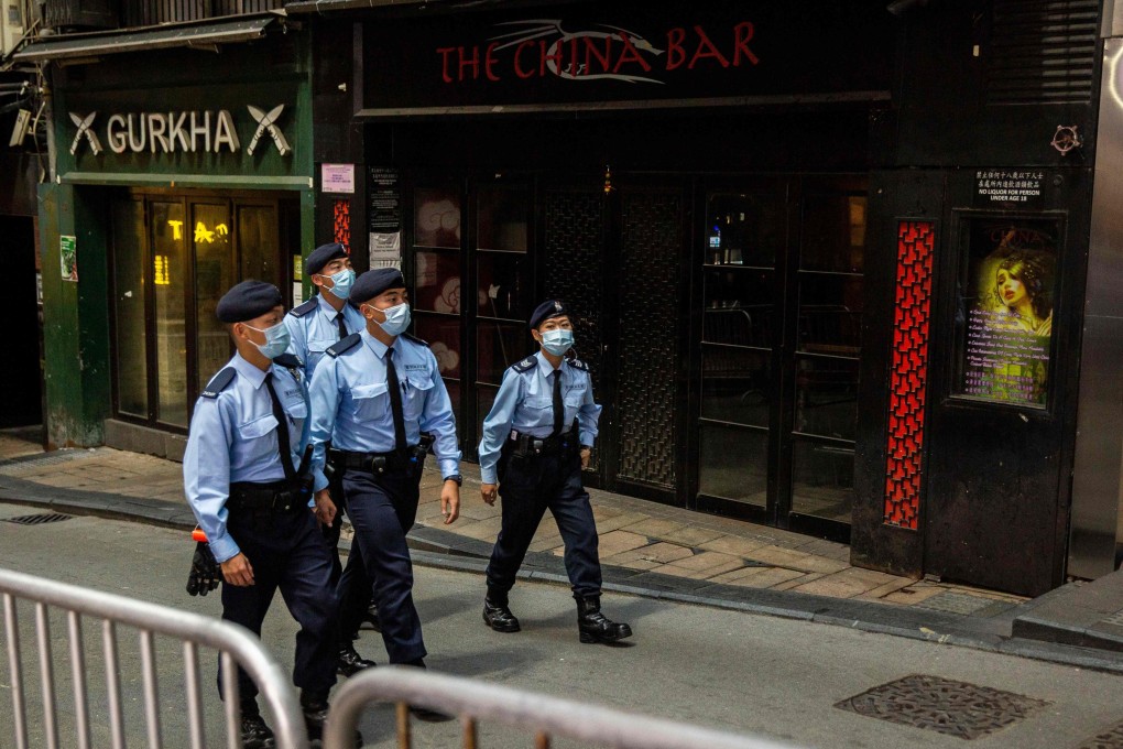 Hong Kong police officers patrol the party district of Lan Kwai Fong in Central on Christmas Eve. Photo: AFP