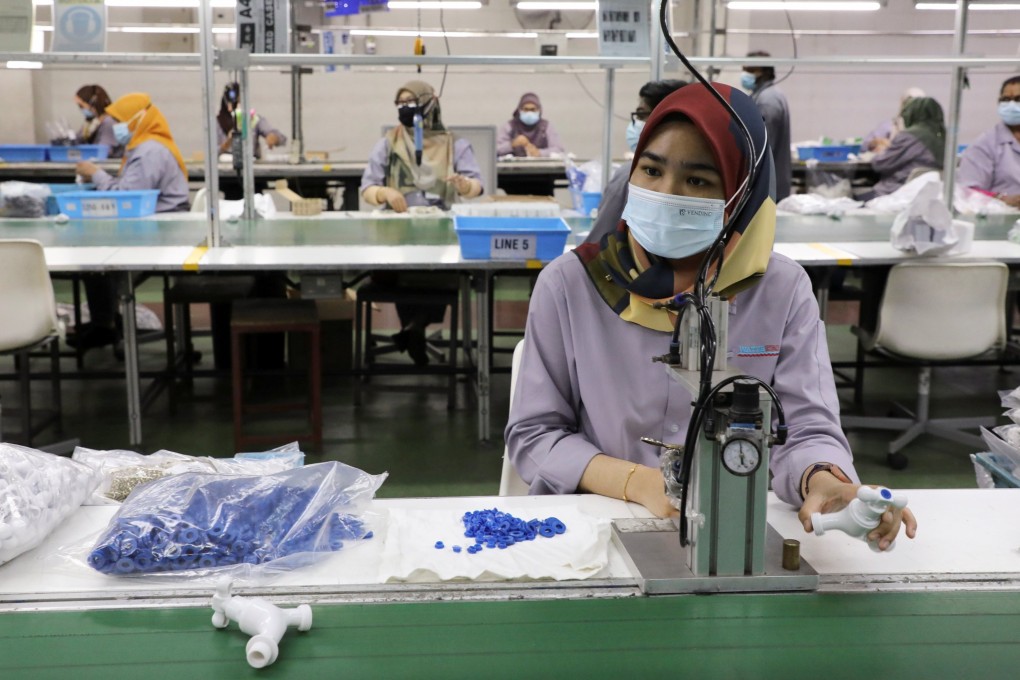 Factory workers in Shah Alam, Malaysia. Photo: Reuters