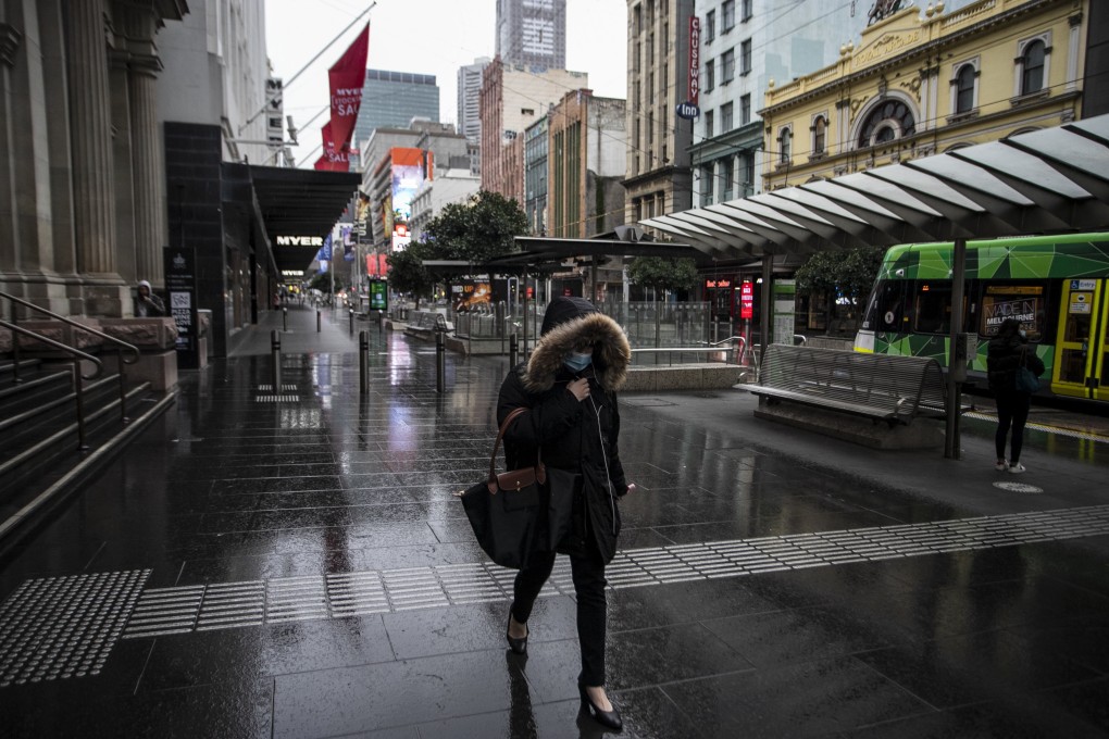 A woman walks along Bourke Street mall in Melbourne, Victoria, on July 20, days after the Australian state entered a lockdown in response to a surge in Covid-19 cases. Photo: EPA-EFE