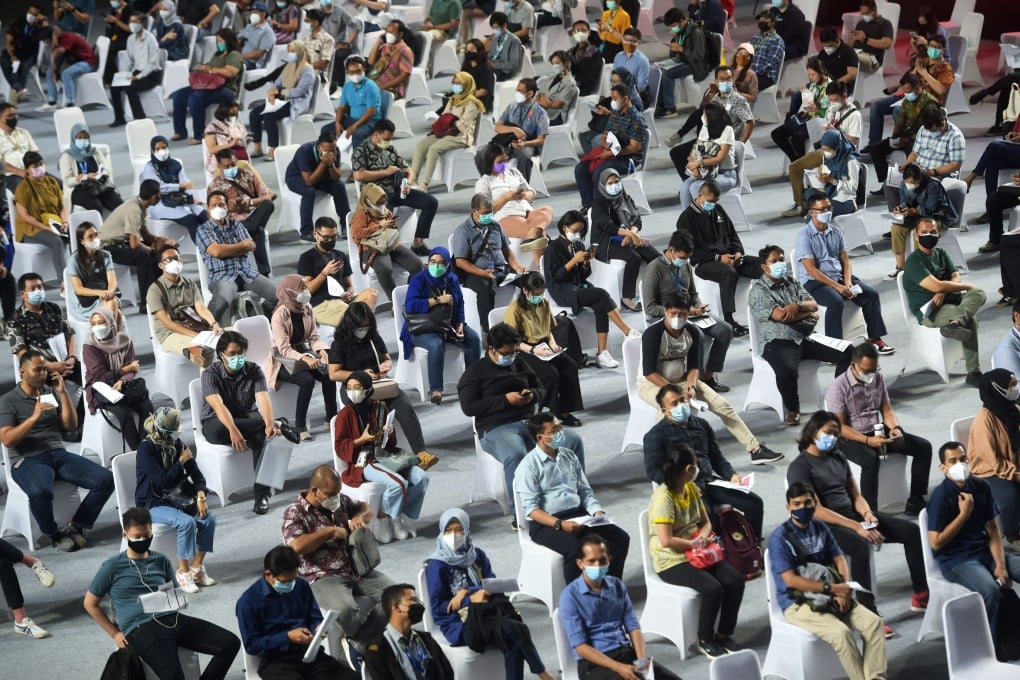 People wait to receive Covid-19 vaccines during a mass vaccination drive in Jakarta, Indonesia, on June 16. Photo: Xinhua