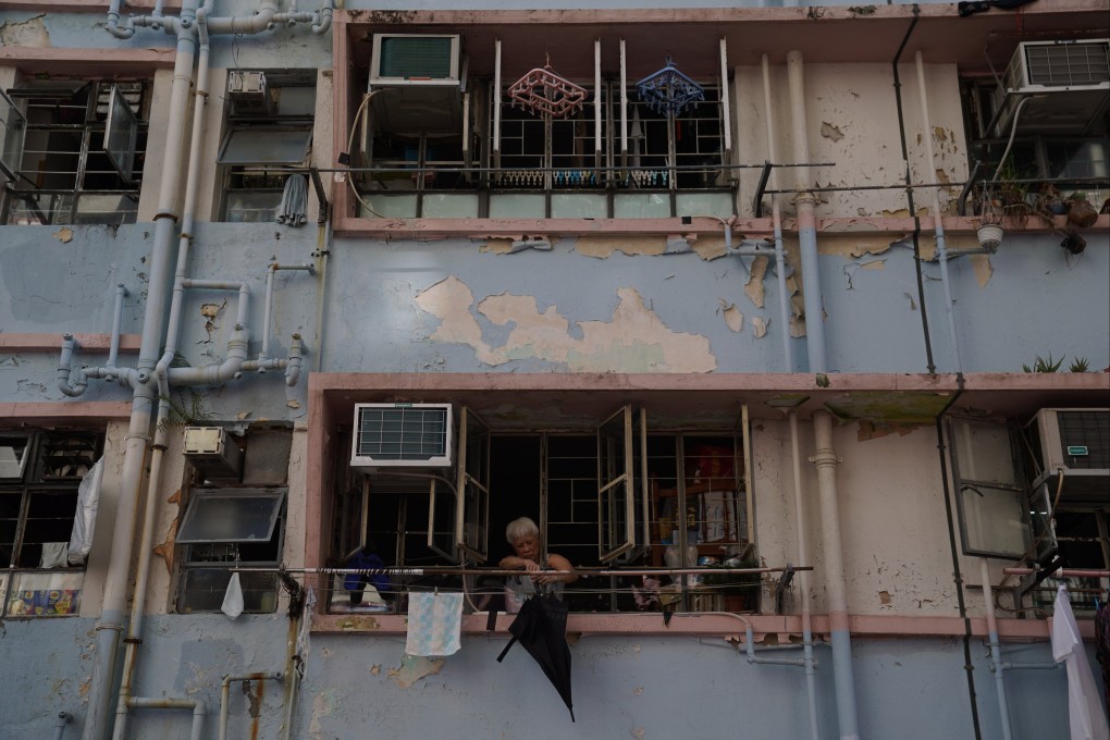 An elderly person holds an umbrella at the Yue Kwong Chuen estate in Aberdeen on July 8. Photo: Sam Tsang