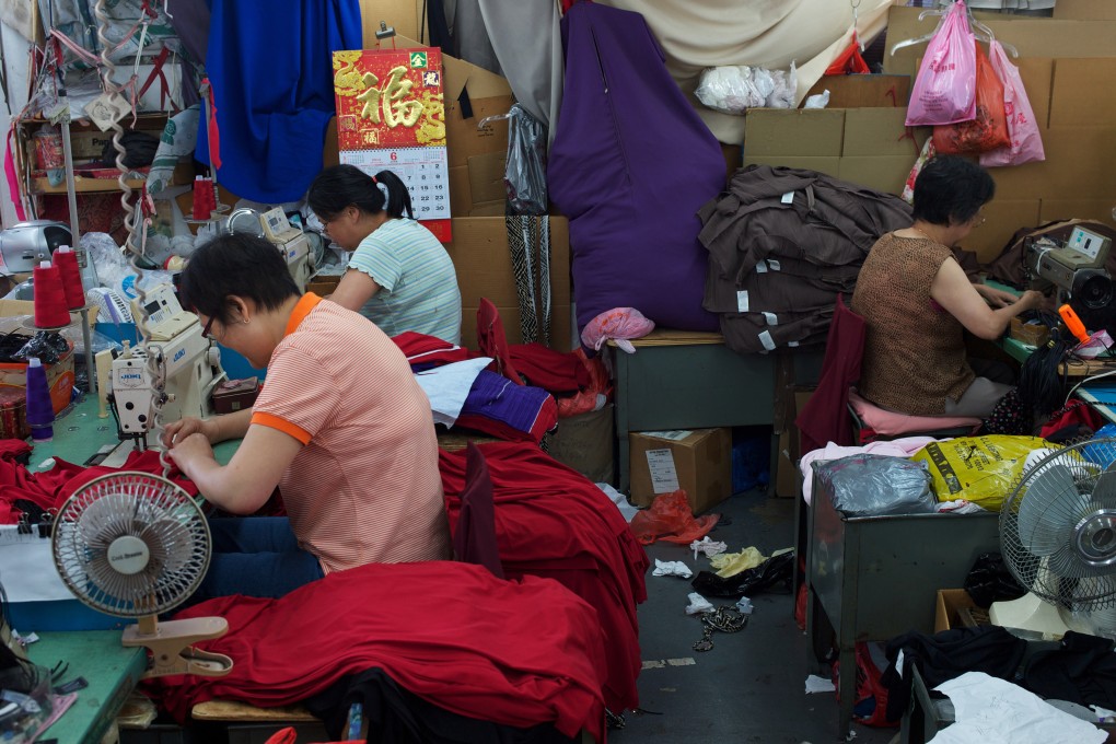 Women work in a sweatshop in Brooklyn, New York. Anna Qu, author of Made in China, was sent to work in one her mother and stepfather owned at the age of 15. Photo: Andrew Lichtenstein/Corbis via Getty Images