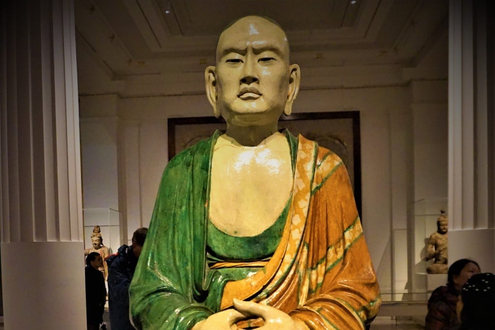 One of the life-size, lifelike “luohan” Buddhist statues that art dealers exported from China just over a century ago on display in the British Museum. A retired Hong Kong civil servant and ceramics enthusiast has cast doubt on their origin. Photo: British Museum