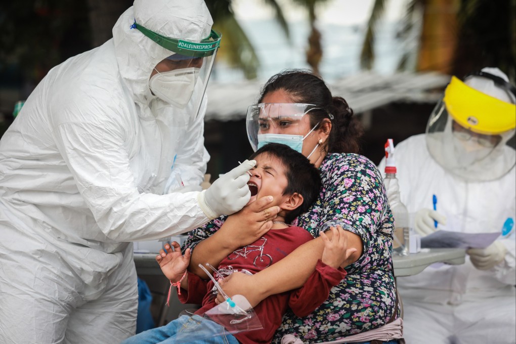 A health worker performs a Covid-19 test on a minor, in Acapulco, Mexico, on July 29. The WHO is calling for at least 10 per cent of the population of every country to be vaccinated by September. Photo: EPA-EFE