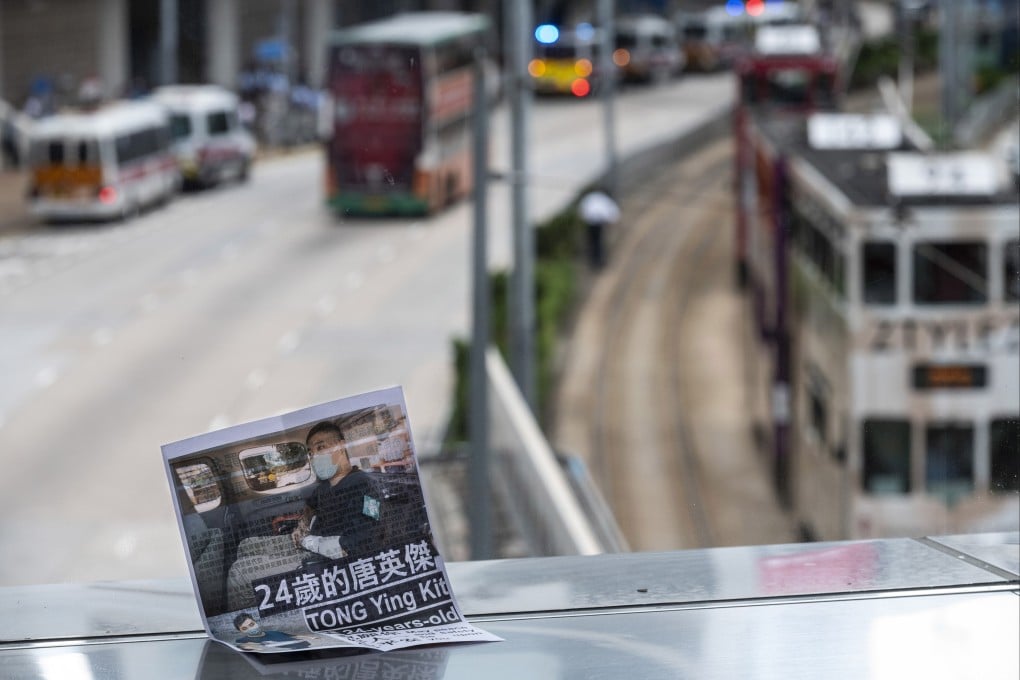 A flyer lies on the ground in support of Leon Tong Ying-kit, the first person convicted under the Hong Kong national security law, near the High Court in Hong Kong on July 30. Tong was sentenced to nine years in prison for driving his motorcycle into a group of police officers last year while flying a flag calling for the city’s “liberation”. Photo: EPA-EFE