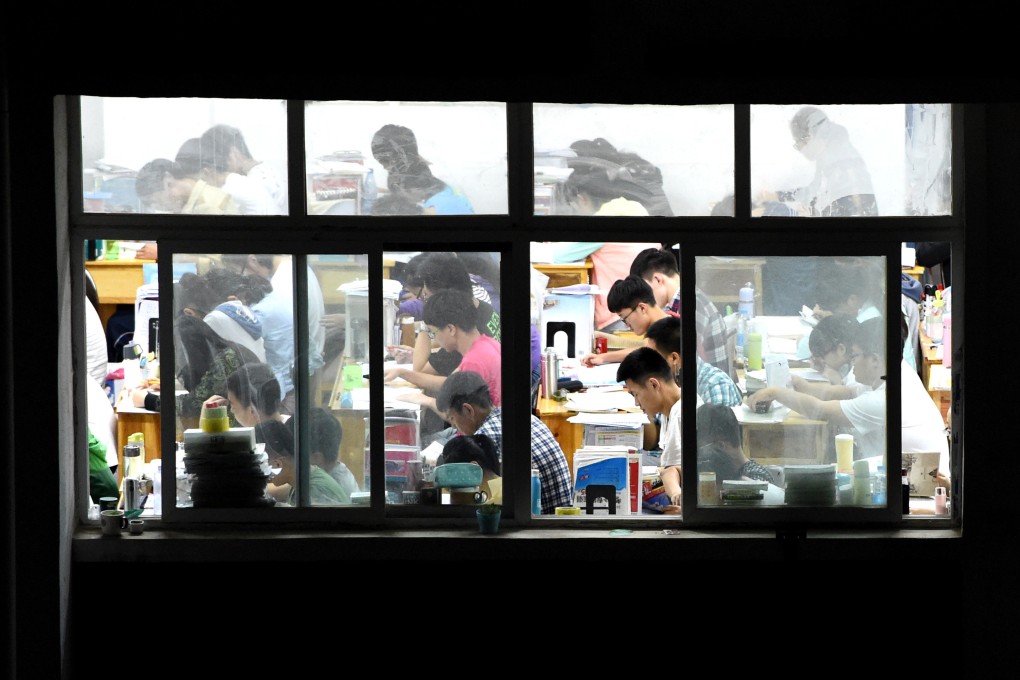 High school pupils at an elite school in Henan province cram for their exams late at night in 2016. China’s highly competitive education system has led to the emergence of cram schools that preyed on parents’ drive to help their children excel in school. Photo: Xinhua