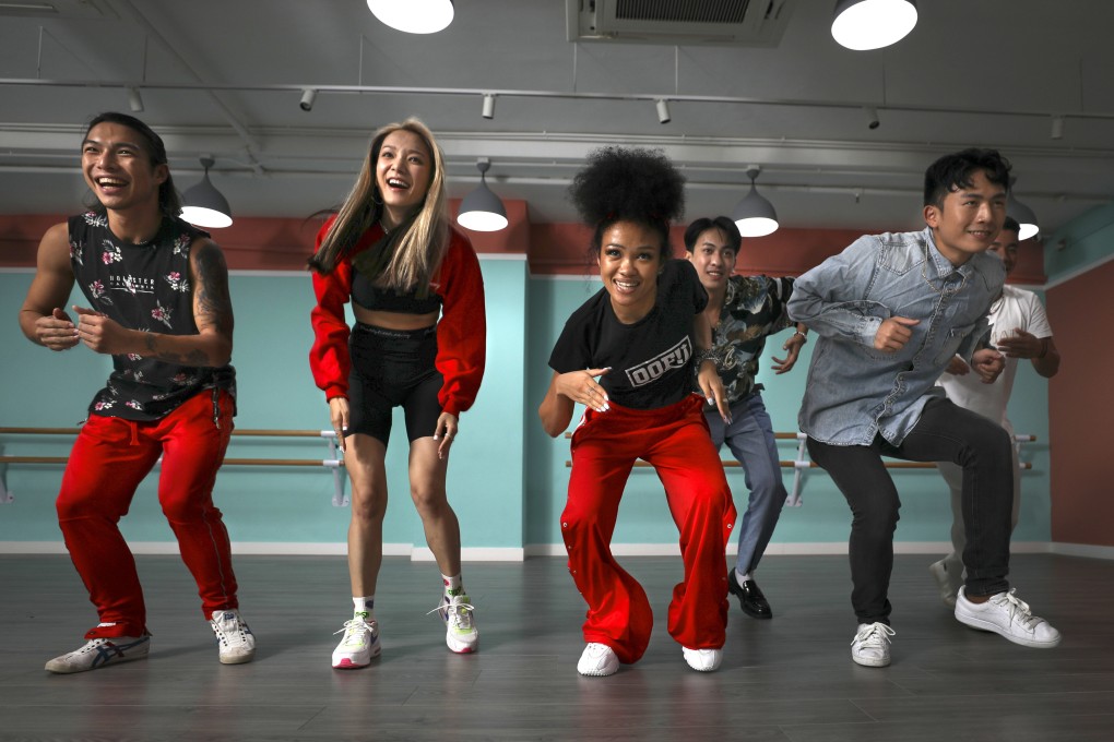 Anisha Thai (centre) performs a dance routine with her group, Hot Flavas, at de Place dance studio in Kwun Tong, Hong Kong. Photo: James Wendlinger