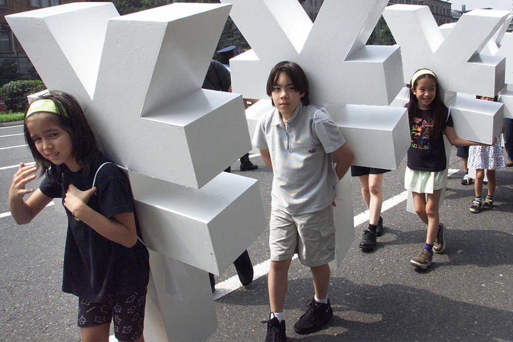 Children carrying yen symbols march for the debt relief movement Jubilee 2000 in Tokyo on July 6, 2000, ahead of the G8 finance ministers’ meeting. Photo: Reuters