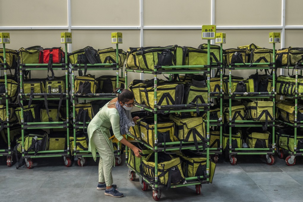 Workers prepare delivery bags at a BigBasket warehouse in Noida, Uttar Pradesh, India, on June 28. In a sign of the extent to which the pandemic has catalysed a rebalancing of investors’ real estate portfolios, logistics and industrial deals constituted 30 per cent of investment activity last quarter, the same share as the office and retail sectors. Photo: Bloomberg