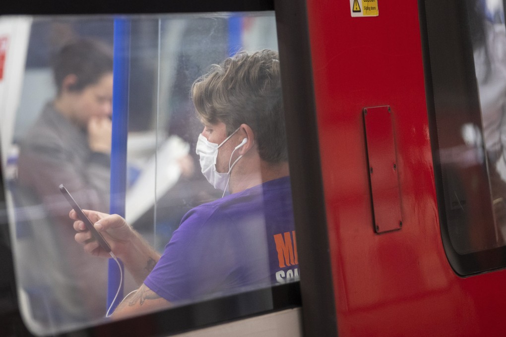 A headphone-wearing commuter in London. A study by audio firm Jabra reveals more than a third of British headphone users wear them to avoid having to talk to other people, and that the average Briton goes five weeks without speaking to someone new. Photo: Getty Images